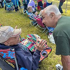 People enjoying themselves at the powwow