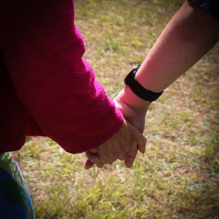 two people holding hands