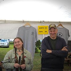 People selling t-shirts at the powwow