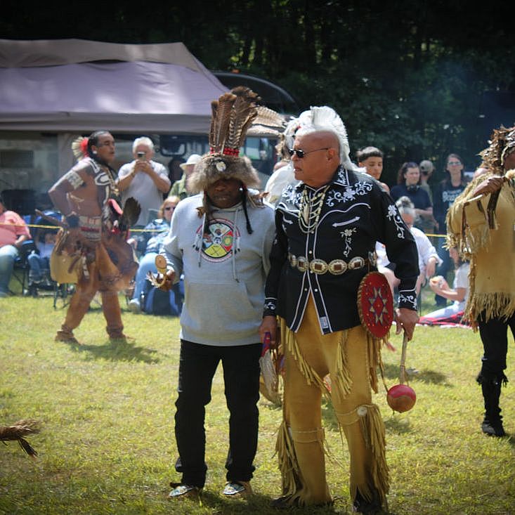 two men at powwow talking