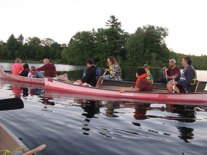 people in canoes enjoying the outdoors